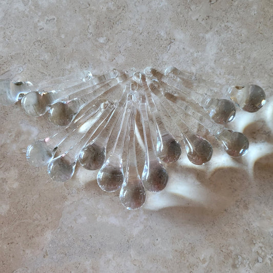 2 Sisters Artisan Glass Set of 14 clear glass raindrop ornaments. These add so much glimmer to a Christmas tree or as chandelier replacement drops.
