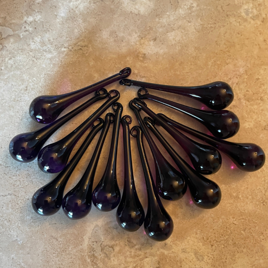 2 Sisters Artisan Glass Set of 14 deep, dark purple glass drops. Dark and moody - the glass raindrops almost black until they are backlit. Handmade purple glass drops are perfect for holiday tree or Mardi Gras!