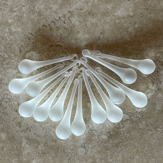 2 Sisters Artisan Glass Set of 14 handmade frosted clear glass drops. These glass raindrops have a festive white, frosted look and catch the light just right. Gorgeous as glass icicles on a Christmas tree!